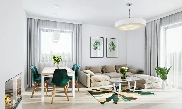 Nowoczesny salon z jadalnią w projekcie domu Kasia 2. Jasne wnętrze z beżową kanapą, zielonymi krzesłami i geometrycznym dywanem.
